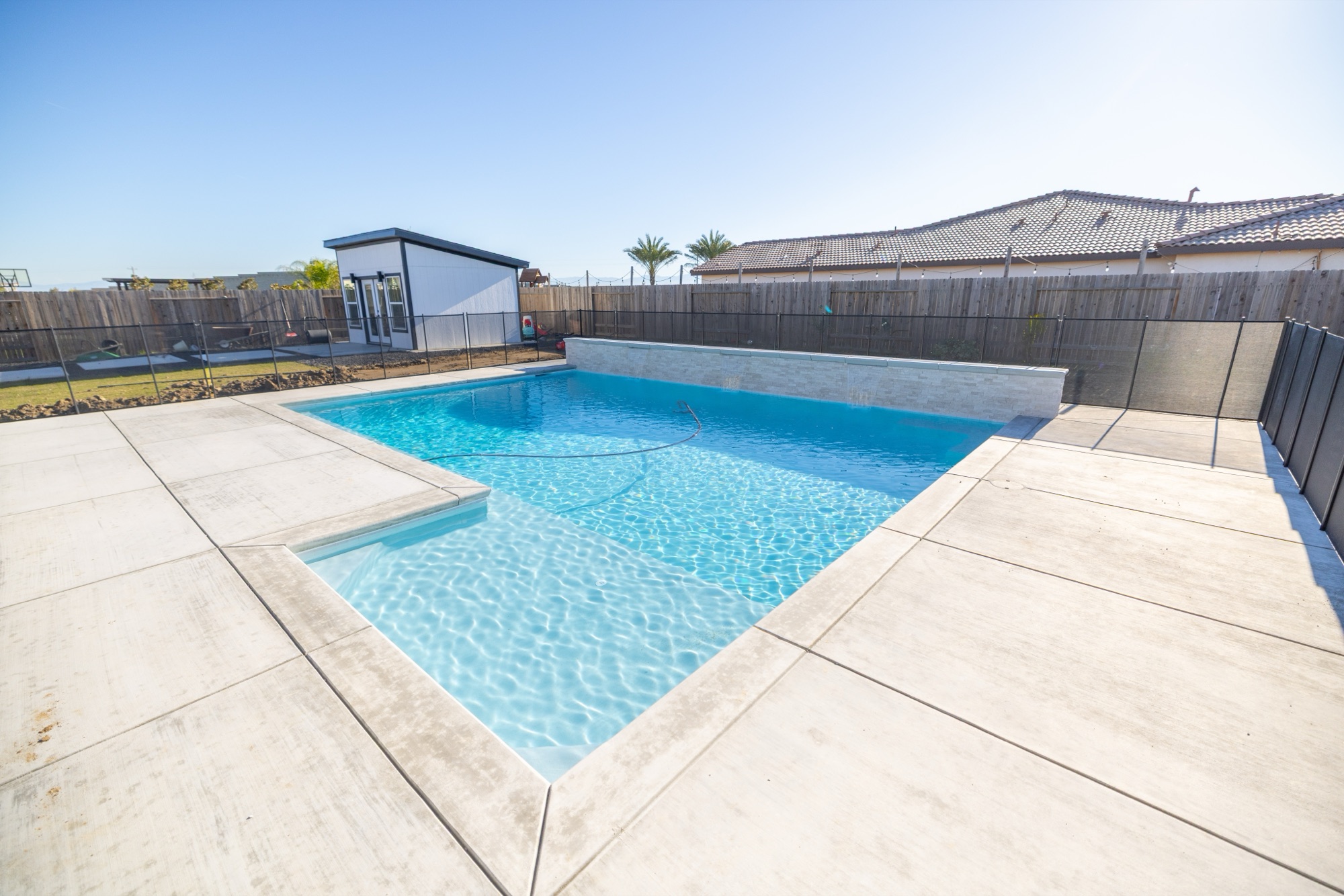 Custom gunite pool with concrete decking — Bakersfield, CA